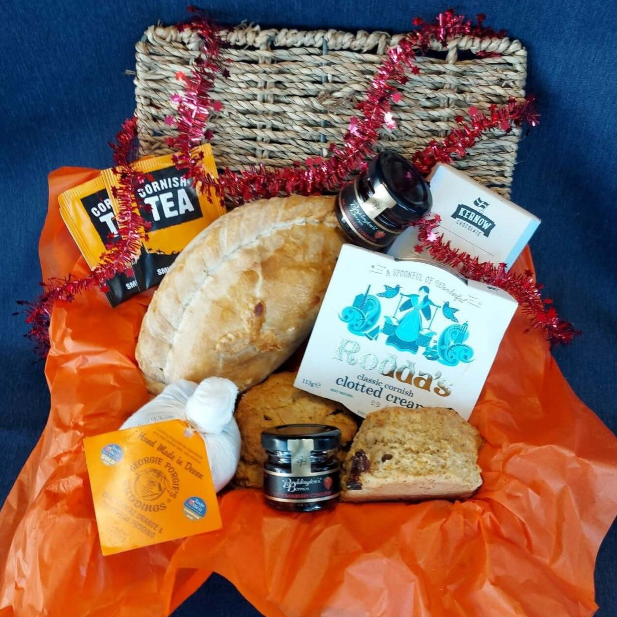Christmas proper job hamper for one, with our delicious Christmas cream tea, Christmas pasty, cream tea chocolate bar and a Christmas pud.