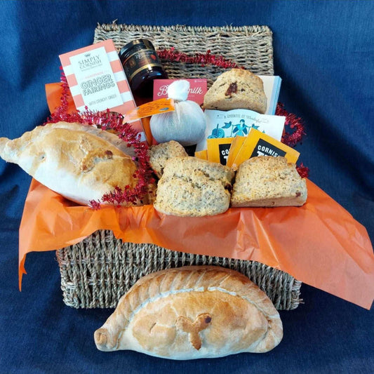 Christmas proper job hamper for two, with our delicious Christmas cream tea, Christmas pasty's cream tea chocolate bar, box of fairings, box of fudge and a Christmas pud.